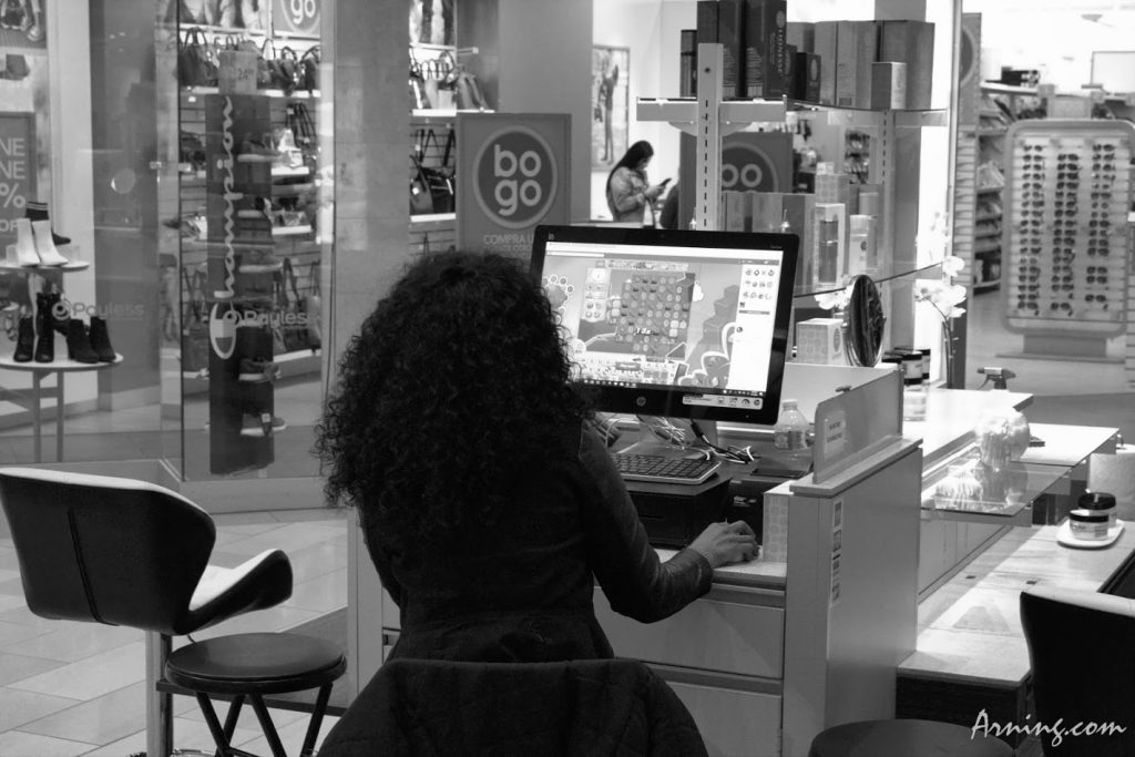 Woman at  the Coronado Mall playing playing a game at work.